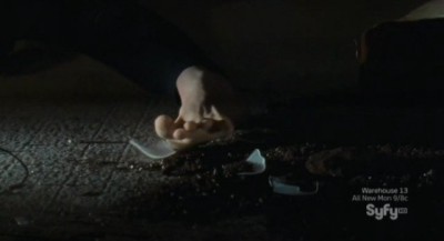 Haven S3x01 - Audrey uses her toes to snag a piece of glass
