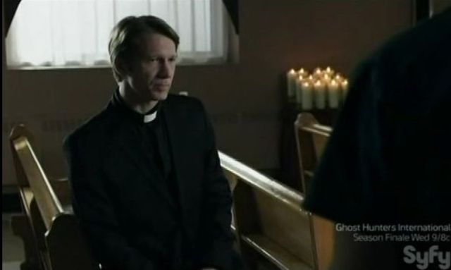 Priest in chapel