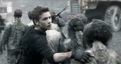 Falling Skies S3x01 - Ben helps load the harnessed Skitter slaves on trucks