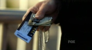 Alcatraz S1x01 - Sylvane with ticket and modern currency
