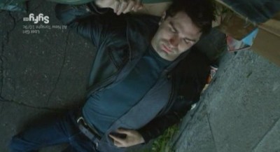 Being Human S3x10 - Aidan is knocked out behind some garbage cans in an alley