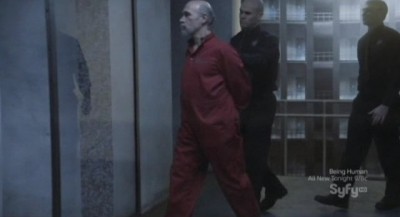 Continuum S1x10 - Kagame is lead to his cell at CPS HQ