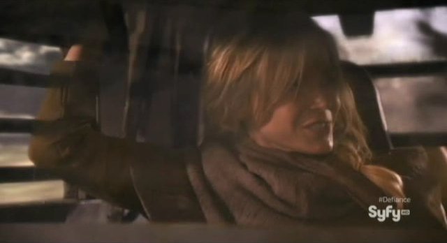 Defiance S1x01 - Amanda Rosewater smiles at handsome devil Nolan during the car chase