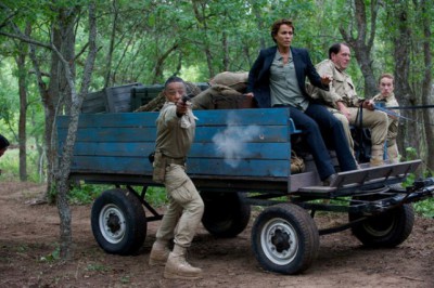 Revolution S2x05 - Neville fires to protect Allendford killing the rogue Patiot commander "One Riot, One Ranger" Episode 205 -- Pictured: (l-r) Giancarlo Esposito as Major Tom Neville, Nicole Ari Parker as Secretary Justine Allenford -- (Photo by: Felicia Graham/NBC)