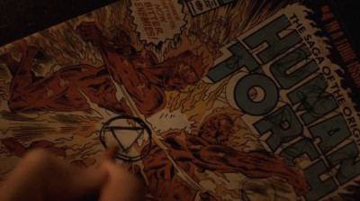 Revolution S2x06 - Aaron is drawing the Patriot symbol on the Human Torch comic book