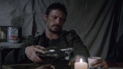 Revolution S2x06 - Monroe on a drinking binge after slaughtering all the inhabitants in the adjoining settlement three years after the blackout