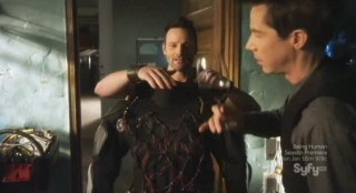 Sanctuary S4x12 - Tesla examining Henrys suit