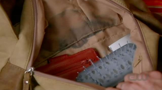 Supernatural S7x08 - Becky sees the potion has completely leaked in her purse.