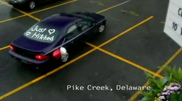 Supernatural S7x08 - Sam and Becky arrive in Delaware in car that says Just Hitched.