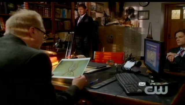 Supernatural S7x13 - Professor Morrison looking at the symbol being carved in to victim's chests