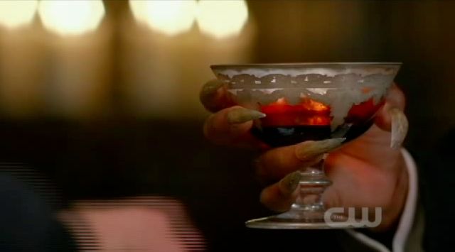 Supernatural S7x22 - The Alpha hands over a cup of his blood to Sam